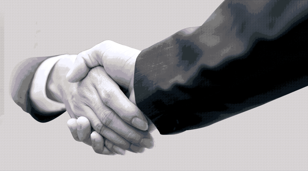 Background image of two men shaking hands.